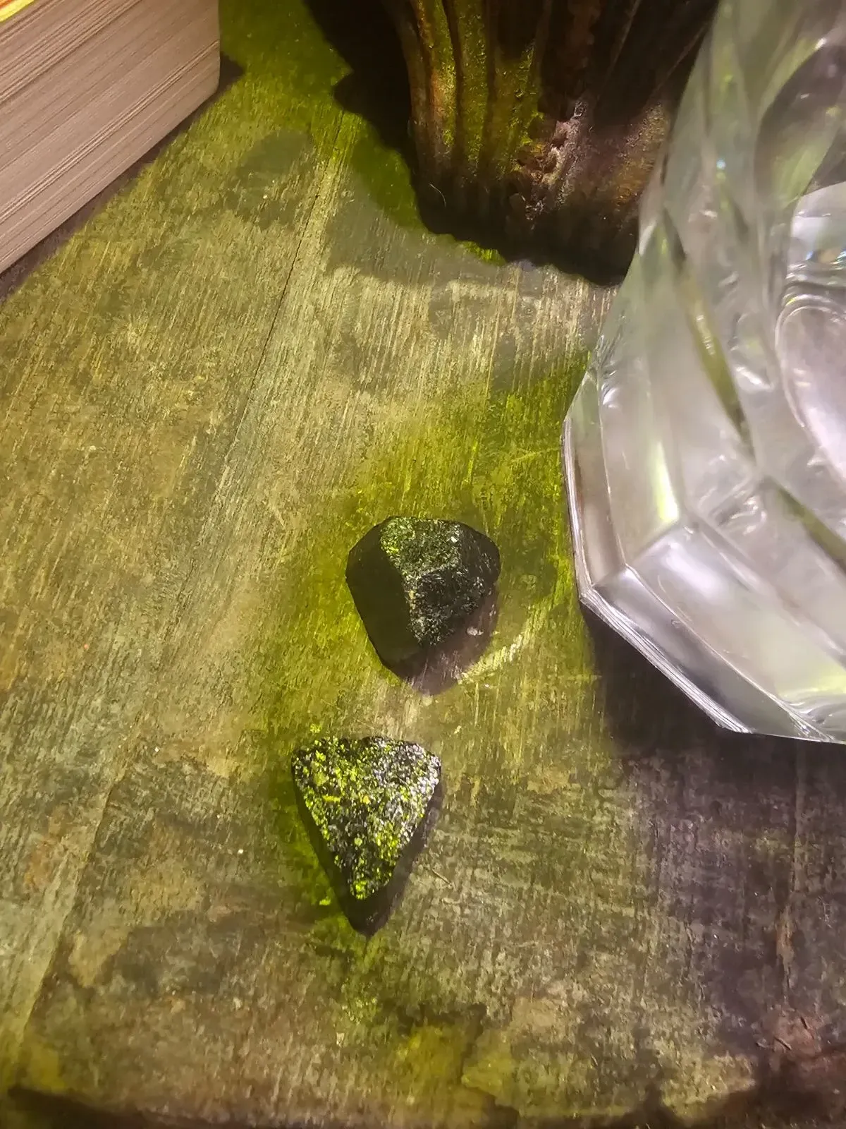 Dark stones near glass object