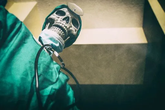 Skull-faced doctor wearing scrubs