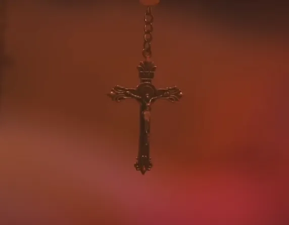Close-up of ornate crucifix pendant