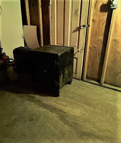 Antique safe in garage corner