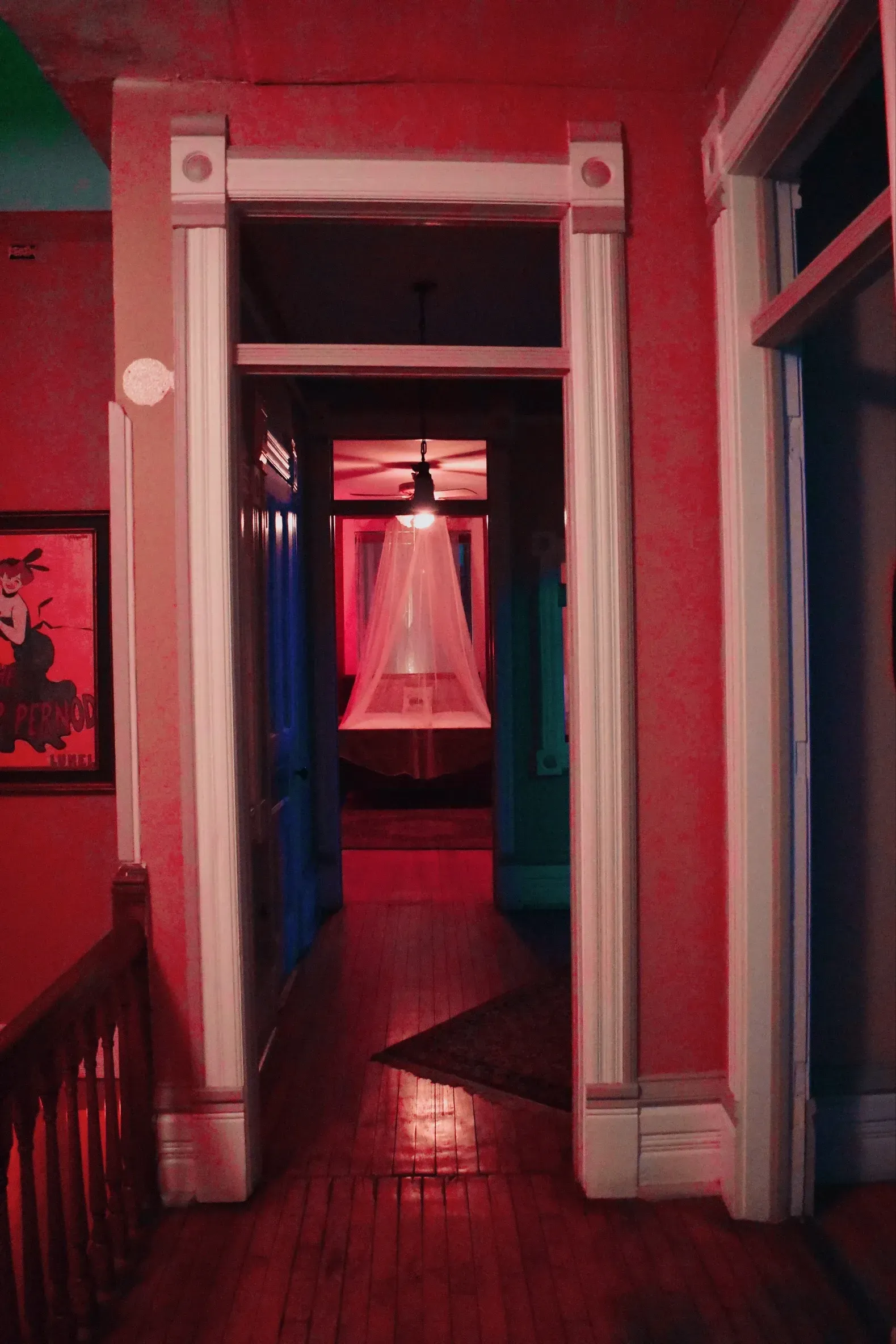 Atmospheric hallway featuring a central chandelier