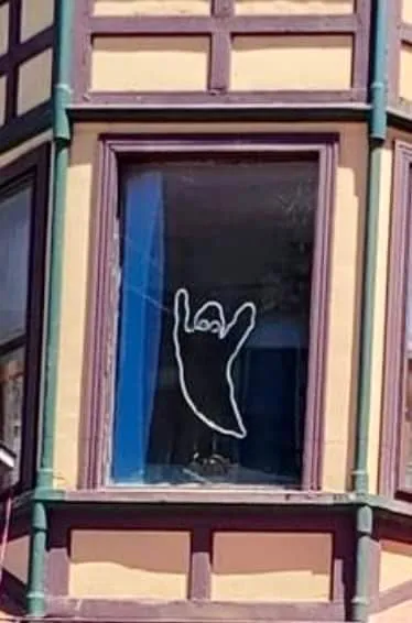 Spooky ghost outline in window