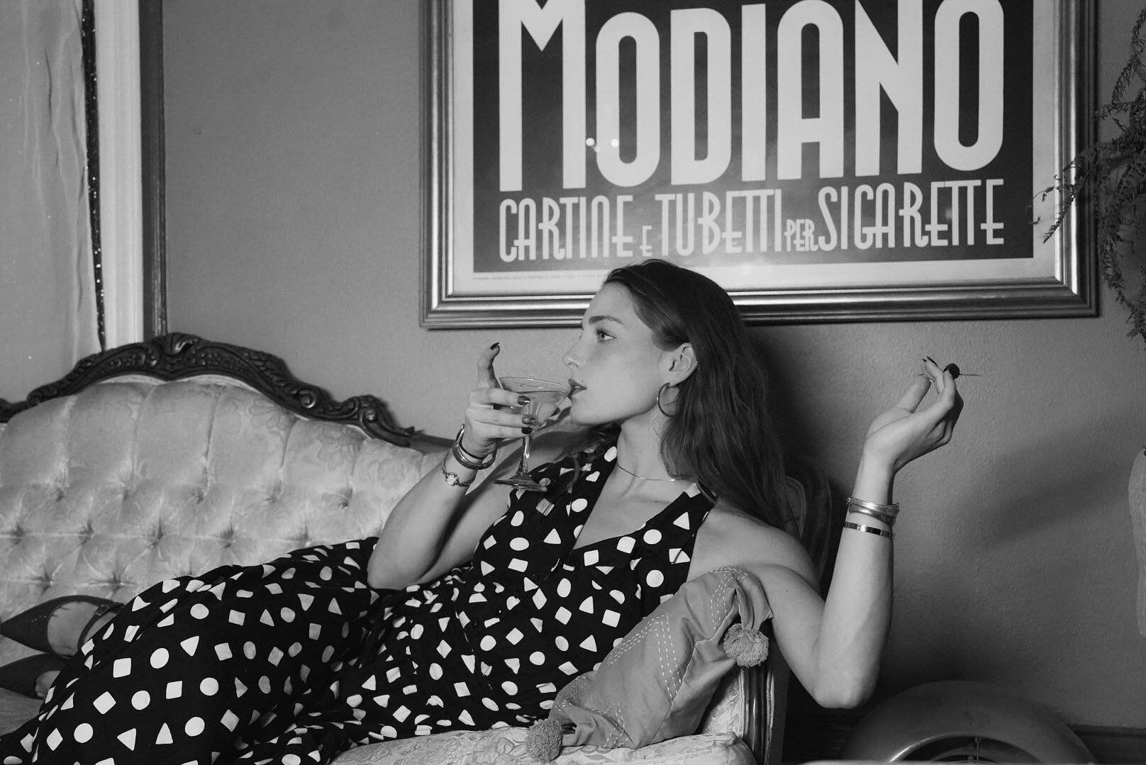 Woman relaxing with drink and cigarette