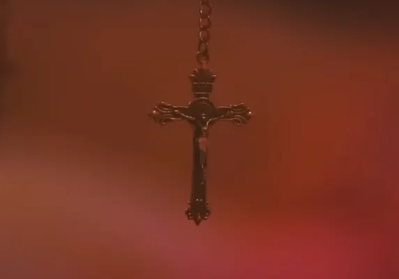 Close-up of ornate crucifix pendant