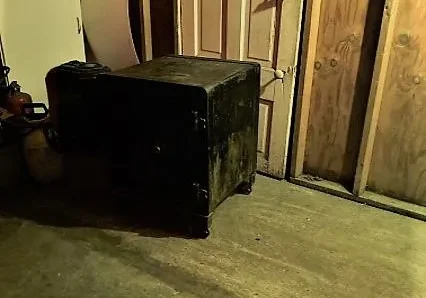 Antique safe in garage corner