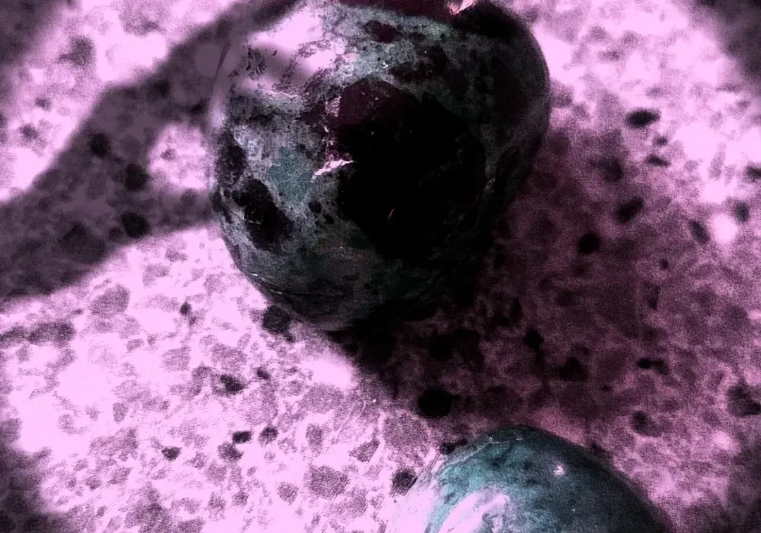 Stones illuminated by soft purple glow.