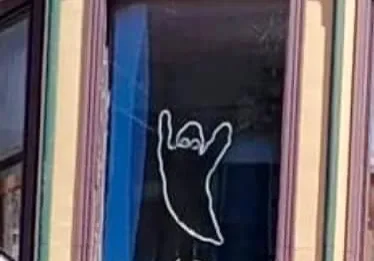Spooky ghost outline in window