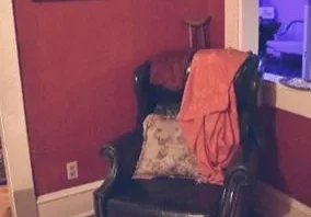 Cozy chair with pillow and blanket