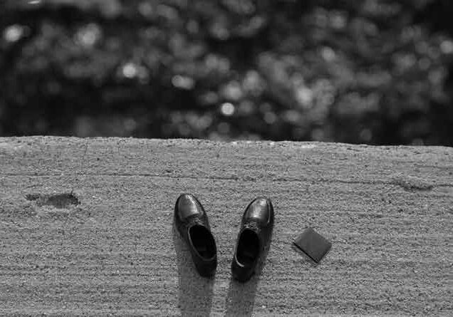 Pair of shoes near a drop-off